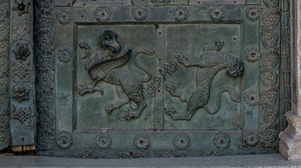  Monreale Cathedral, the gate by Bonanno Pisano (1185-6): bronze tile depicting a grifo and a lion. The gate is signed "Bonanno civis pisanus". It depicts five scenes of the Old Testament at the bottom, starting with Adam and Eve, and five scenes of the New Testament at the top, ending in "Christ and Mary in the glory of Paradise".