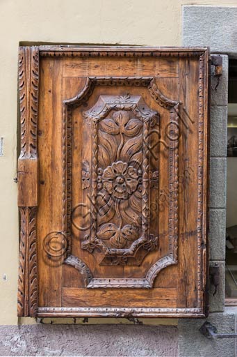  Bormio: old house wooden door with stone jamb.