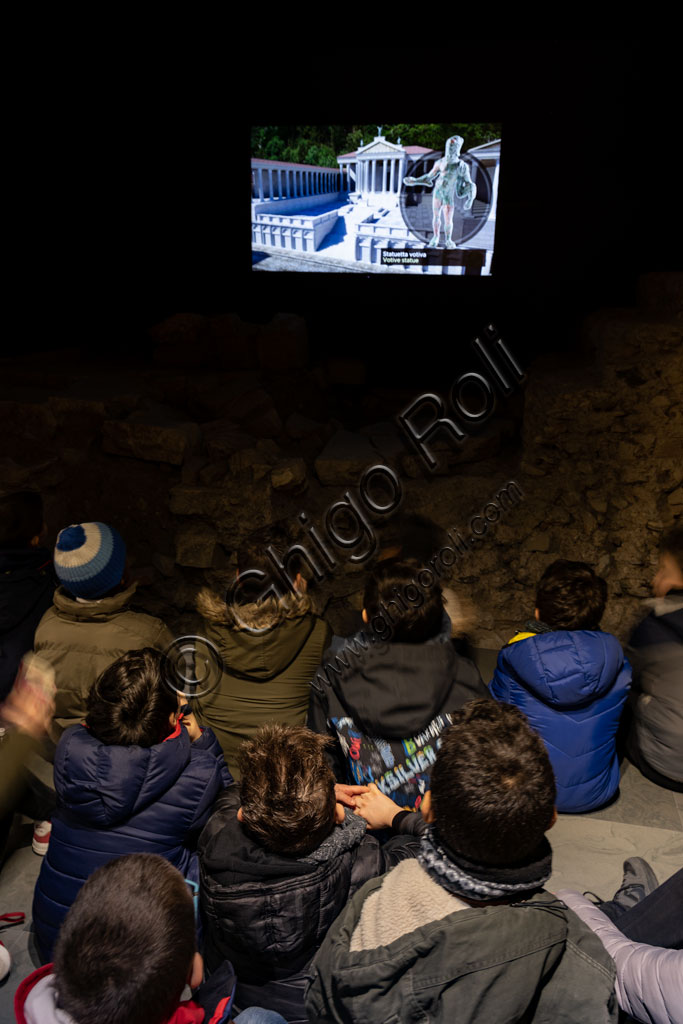 Brescia, the archaeological area of the Capitolium in the ancient Brixia, Unesco heritage since 2011, the Sanctuary of the Republican age (I century BC): children of a school group follow an educational film.