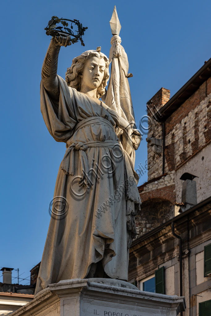 Brescia, piazza della Loggia (a Renaissance square where the Venetian influence is evident): the marble monument "Bella Italia or Bell'Italia"  by Giovanni Battista, 1864. Dedicated to the fallen of the Ten Days of Brescia, it was given to the city by Vittorio Emanuele II.