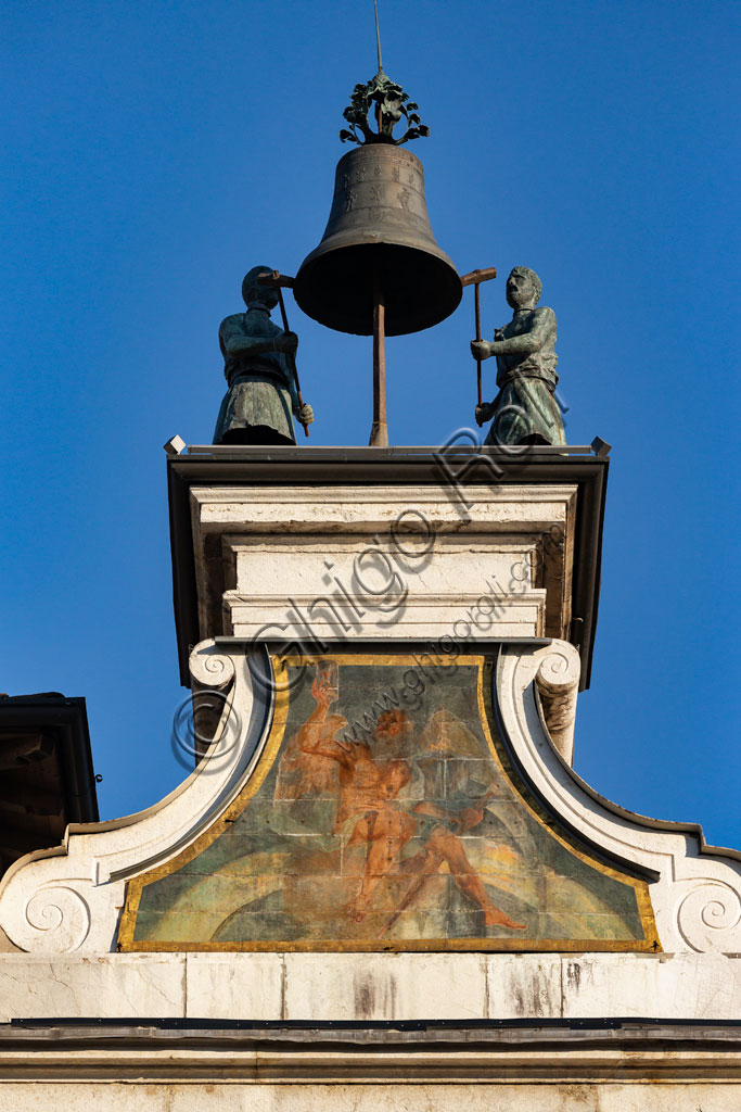 Brescia, piazza della Loggia (a Renaissance square where the Venetian influence is evident): the Clock Tower (1540 - 1550): the plinth adorned with the symbol of the sun and a volute base that stand as a pedestal for the automata, the popular Macc de le ure (crazy hours) that hammer at every hour on the bell.