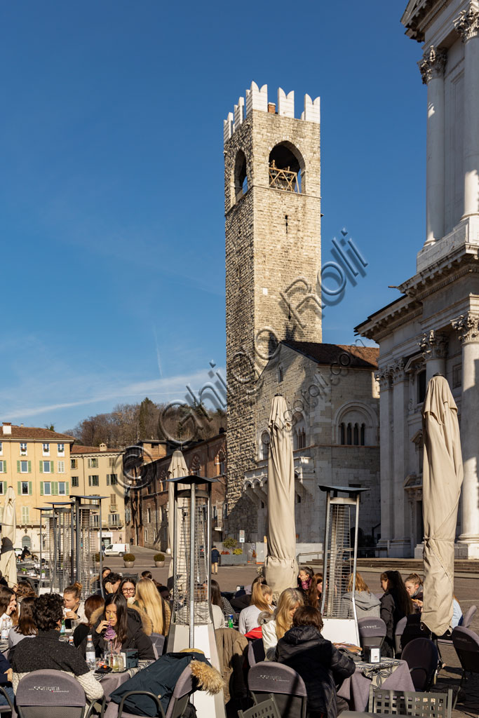 Brescia, Paolo VI Square: from the left, the Broletto with the Pégol Tower and the Loggia delle Grida;  the Duomo Nuovo  (the New Cathedral) , in late Baroque style with the facade of Botticino marble.