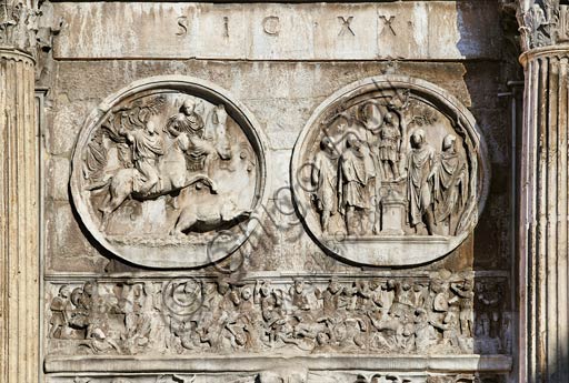  Rome, Roman Forum: Arch of Constantinus. Detail showing in the left medallion "Bear Hunting", in the one on  the right "Sacrifice Scene", In the lower relief "The Battle of Ponte Milvio". 3rd and 4th Century AD.