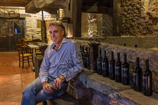 Candelo, Ricetto (fortified structure) Restaurant Il Torchio 1763:  the room with the ancient winepress and the owner Alberto Barbirato.