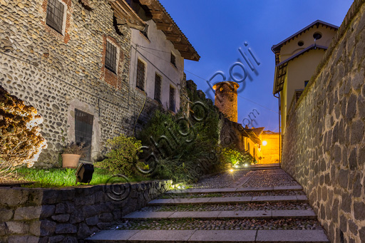 Candelo, Ricetto (fortified structure): a night view of the Lizza street and the  EasternTower.