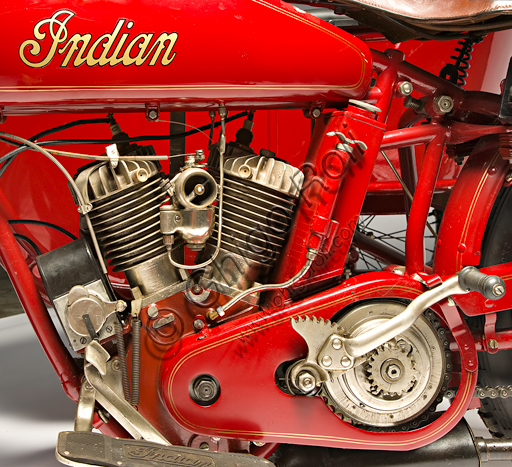 Vintage motorcycle Indian Powerplus 1000 Side.Brand: Indianmodel: Powerplus 1000 Sidecountry: U.S.A. - Springfieldyear: 1919conditions: restoreddisplacement: 61 ci (987.7 cc. bore and stroke 79.3 x 100)engine: 42 ° V twin cylinder with side valvesgearbox: three-speed with hand controlThe Indian Motorcycle Manufacturing Company is the oldest U.S. motorcycle factory. Founded by George M. Hendee and Carl Oscar Headstrom in 1901, two years before Harley Davidson, it was always on the cutting edge of technology. In 1911 he built four-valve racing engines, in '12 he introduced the rear suspension, in '14 he also provided the electric starter as an option. With the first twin-cylinder Erwin Baker "Cannonball" sets many records on long distance races. In 1914 he went from San Diego to New York, beating previous records in "only" 11 days and twelve hours.In 1916, the Powerplus twin-cylinder of the model shown here came out. It was a silent, elastic and powerful V-twin engine that reaches 60 mph (96 km / h) and had a great success both as an engine for tourist use and as a base for racing bikes.
