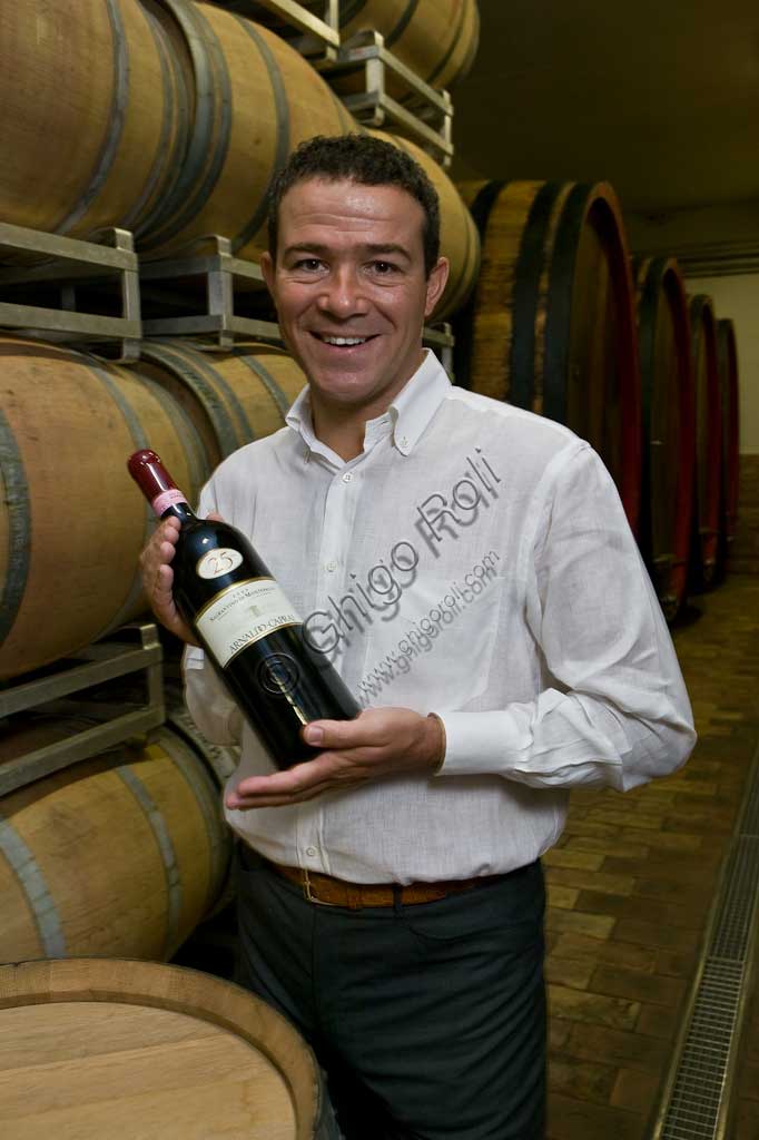 Winery Arnaldo Caprai: Marco Caprai, owner of the "Cantina Arnaldo Caprai" amont the barrels of the Sagrantino wine of Montefalco.