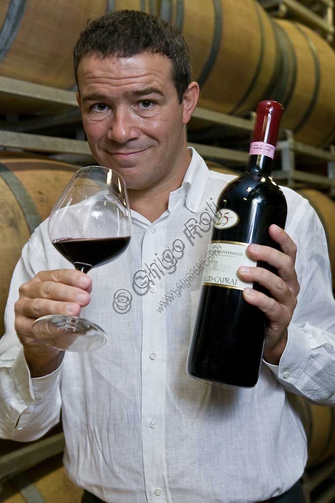 Winery Arnaldo Caprai: Marco Caprai, owner of the "Cantina Arnaldo Caprai" amont the barrels of the Sagrantino wine of Montefalco.