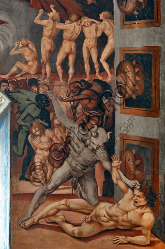  Orvieto,  Basilica Cathedral of Santa Maria Assunta (or Duomo), the interior, Chapel Nova or St. Brizio Chapel, southern wall:  "Call to Hell", fresco by Luca Signorelli, (1500 - 1502). Detail showing the Antehell, taken from Dante's description. A group of slothers has a demon bearing a white banner, while in the centre you can see Charon ready to ferry the damned, destined, lower down, to the judgment of Minos. The latter is portrayed when he commits punishment to a damned man by a demon's hair, wrapping his tail around his body as many times as the number of the group he is destined for. Further on, on the "proscenium", a devil with blue flesh makes to hit a damned man by holding his hair: the crudeness of the scene interested Michelangelo, who in fact copied it.