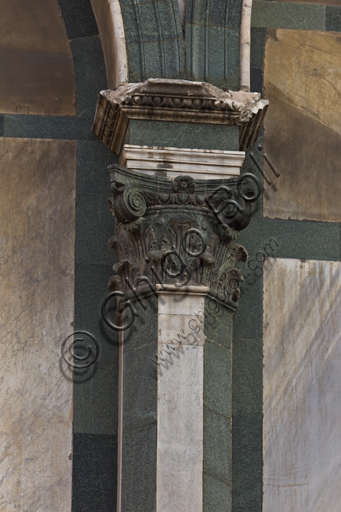 Florence, the Baptistery of St. John, exterior, the Southern façade in Carrara white marble and green Prato marble: detail of a column with capital.