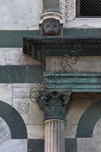 Florence, the Baptistery of St. John, exterior, the Northern façade in Carrara white marble and green Prato marble: detail of a column with capital.