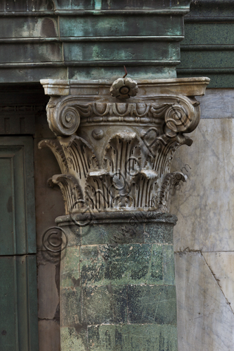 Florence, the Baptistery of St. John, exterior, the Northern façade in Carrara white marble and green Prato marble: detail of a column with capital.