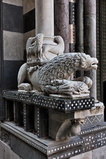 , Genoa, Duomo (St. Lawrence Cathedral), the façade, West side, North - West corner: base of column with "lions and lionesses, column bearing lion", corbel with the "Eagle of St. John the Evangelist", by workshop of Benedetto Antelami, about 1200.