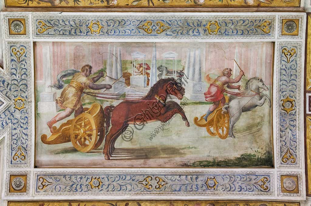 Ferrara, the Castello Estense (the Estense Castle), also known as Castle of St. Michael: detail of the ceiling of the Hall of Games,"The race of the quadriga". The frescoes are designed by Pirro Ligorio. The realization  is by Ludovico Settevecchi.