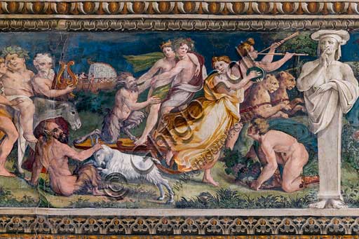 Rome, Villa Farnesina, The Hall of Perspectives: the ample frieze with mythological scenes.Frescoes by Baldassarre Peruzzi and workshop (1517-8). Detail with the Thiasus of Dionysus.Dionysus, embracing Ariadne, moves in a cart drawn by panthers. They are followed by Silenus, drunk and riding a donkey. Other Sileni or satyrs and musicians are part of the procession.