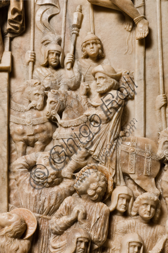 , Genoa, Duomo (St. Lawrence Cathedral), inside, the Southern aisle, southern wall: "Crucifixion" (1443) from the funerary monument of Girolamo Calvi, by Lombard artist of the Gagini workshop.Detail of a man riding a horse.