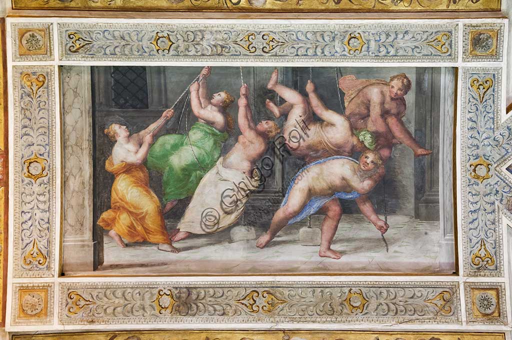 Ferrara, the Castello Estense (the Estense Castle), also known as Castle of St. Michael: detail of the ceiling of the Hall of Games,"The Pyrrhichios dance". The frescoes are designed by Pirro Ligorio. The realization  is by Ludovico Settevecchi.