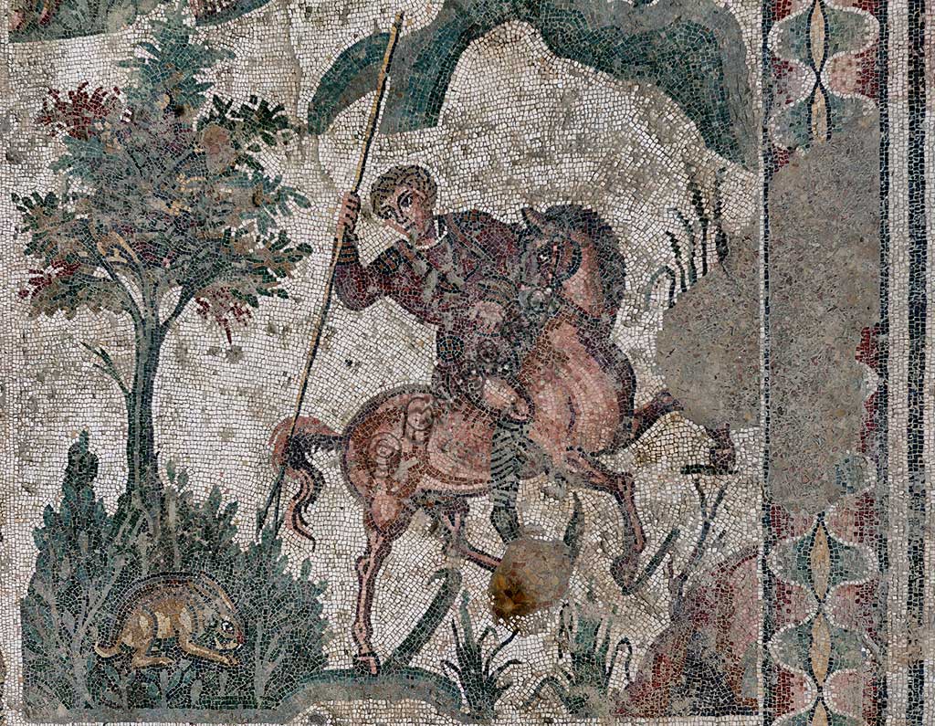 Piazza Armerina, Roman Villa of Casale, which was probably an imperial urban palace. Today it is a UNESCO World Heritage Site. Detail of the floor mosaic in the corridor of the Grat Hunt. In spite of the name with which it is known (The Great Hunt), the subject of the floor mosaic represents a great capture. It does not represent  hunting.Wild beasts are captured for the games in the amphitheatres of the Roman Empire: no animal is in fact shot down and hunters use only weapons to defend themselves.