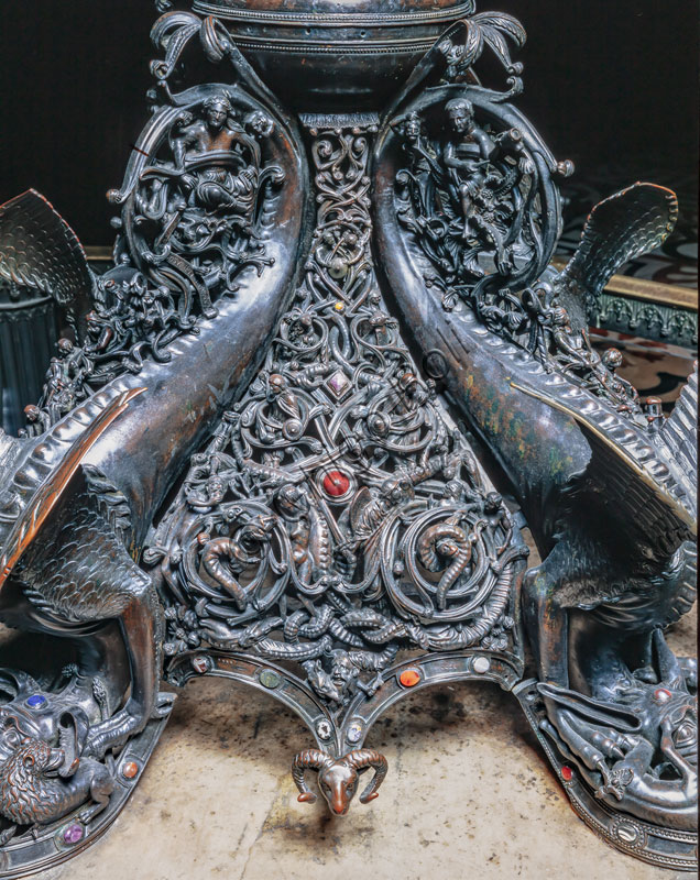  Duomo (the Cathedral), northern arm of the transept: the Candelabra Trivulzio (bronze candelabra, early 13th century). Detail of the foot with chimeric animals, tendrils and spirals.