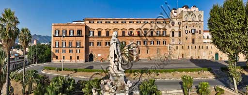 Palermo, The Royal Palace or Palazzo dei Normanni (Palace of the Normans), North-East side: view of the Renaissance wing and the Pisan Tower from Parliament Square. In the foreground, detail of the Marble Theatre, by Gaspare Guercio, Carlo D'Aprile and Gaspare Serpotta, realized to celebrate the glory of Philip IV of Habsburg, king of Spain and Sicily, called Philip the Great.