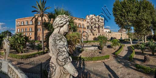 Palermo, The Royal Palace or Palazzo dei Normanni (Palace of the Normans), North-East side: view of the Renaissance wing and the Pisan Tower from Parliament Square. In the foreground, detail of the Marble Theatre, by Gaspare Guercio, Carlo D'Aprile and Gaspare Serpotta, realized to celebrate the glory of Philip IV of Habsburg, king of Spain and Sicily, called Philip the Great.