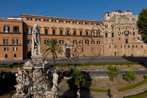 Palermo, The Royal Palace or Palazzo dei Normanni (Palace of the Normans), North-East side: view of the Renaissance wing and the Pisan Tower from Parliament Square. In the foreground, detail of the Marble Theatre, by Gaspare Guercio, Carlo D'Aprile and Gaspare Serpotta, realized to celebrate the glory of Philip IV of Habsburg, king of Spain and Sicily, called Philip the Great.