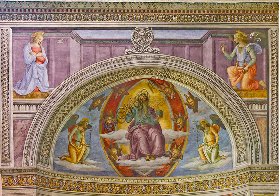 Montefalco, Museum of St. Francis, Church of St. Francis: "Nativity with the Annunciation and the Eternal among angels and cherubs", by Pietro Vannucci known as  Perugino, 1503. Fresco. Detail of  "Annunciation" and "The blessing Eternal between cherubs and two kneeling angels".