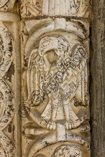 , Genoa, Duomo (St. Lawrence Cathedral), the north side, portal of St. John the Baptist (first half XII century), the jamb: detail of the decoration with eagle, by Lombardy and Como sculptors. The eagle is the symbol of St. John the Evangelist.