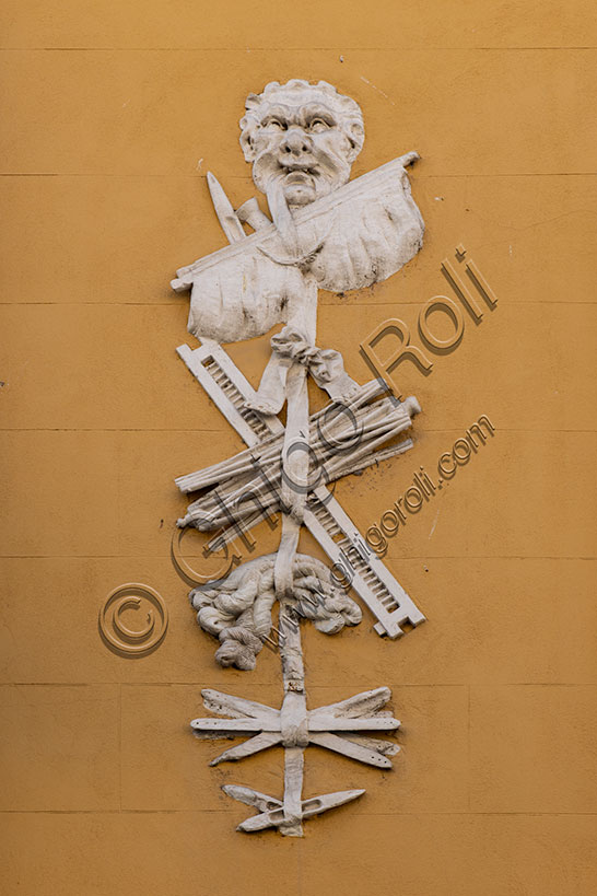 Vicenza: the facade of Gastaldi House in Contrà Porta S. Lucia. Detail of the decoration representing the instruments used in silkmaking.