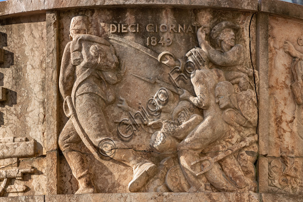 Brescia,piazza della Vittoria (square built between 1927 and 1932) designed by the architect and urban planner Marcello Piacentini: detail of  the Arengario, pulpit in red stone of Tolmezzo decorated with bas-reliefs depicting scenes of the history of Brescia, by Antonio Maraini (1932).