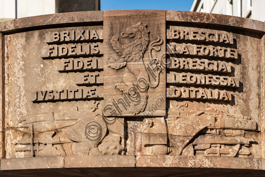 Brescia,piazza della Vittoria (square built between 1927 and 1932) designed by the architect and urban planner Marcello Piacentini: detail of  the Arengario, pulpit in red stone of Tolmezzo decorated with bas-reliefs depicting scenes of the history of Brescia, by Antonio Maraini (1932).