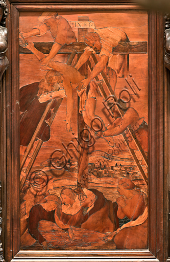 , Genoa, Duomo (St. Lawrence Cathedral), inside,  presbitery, apse, choir, South side: "The Deposition", wood intarsia by  Gian Michele De' Pantaleoni (XVI century).