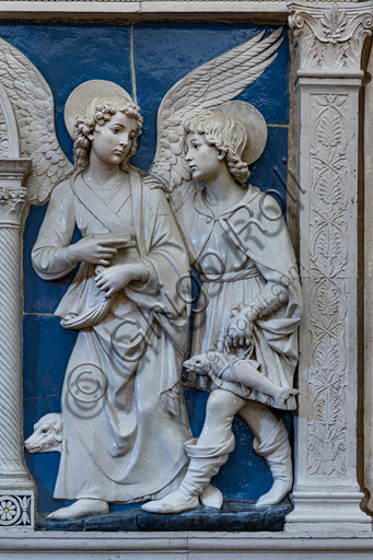 Basilica of the Holy Cross: ""Dossal of an altar with central ciborium". Detail of Archangel Raphael and Tobias,   by Andrea Della Robbia, about 1475, bas-relief polychrome glazed terracotta.