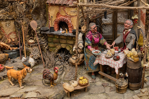 Assisi, Nativity scene: detail with two small statues of an old man and an old woman at the table.