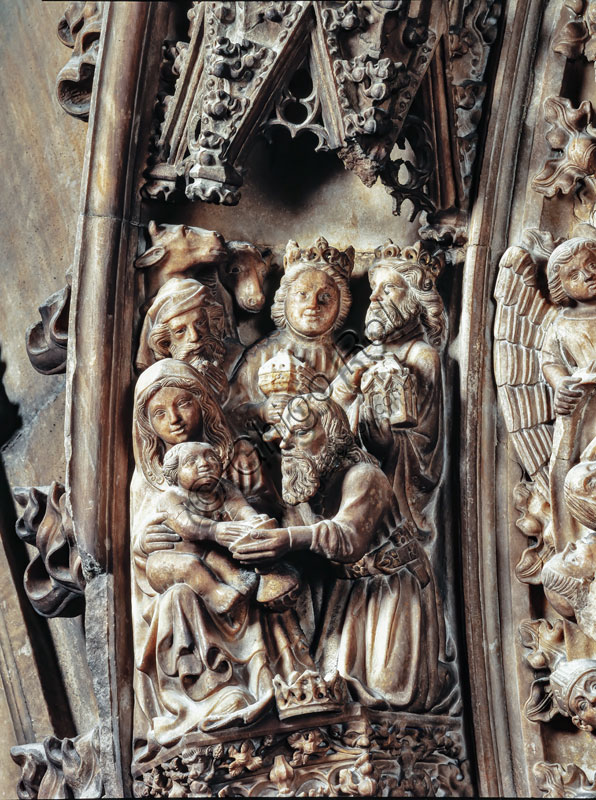  Duomo (the Cathedral): portal of the South sacristy, end XIV century, by Hans von Ernach and other rhenish artists. Detail of the “Adoration of the Magi”.