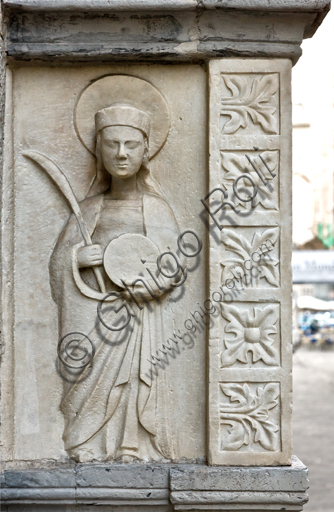 , Genoa, Duomo (St. Lawrence Cathedral, south side: "wall tomb of Antonio Grimaldi - detail with a pilgrim figure holding the palm and the wheel of martyrdom ", after 1402.