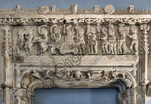  Carved window which had been realised for Marongiu Palace in Sassari at the middle of XVI century in late gothic style. The frieze represents the triumph of Angelo Marongiu in Sassari. The town of Sassari can be recognised with its city walls and towers.Detail.