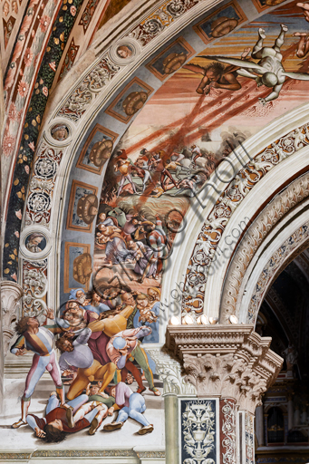  Orvieto,  Basilica Cathedral of Santa Maria Assunta (or Duomo), the interior, Chapel Nova or St. Brizio Chapel, northern wall: "Pandemonium" fresco by Luca Signorelli, (1500 - 1502). Detail. On the left the supernatural events begin, while in the distance wars and murders multiply. It deals with the arrival of monstrous winged demons, from whose hands and mouths a fiery rain is emitted that invests a multitude of terrified people, who is pouring on the stalls outside the border of the painted arch. Particularly effective and well preserved is the tangle of seven young men in the foreground, with flashy clothes, dead or in the act of succumbing, followed by two mothers with their children and a group of young and old.