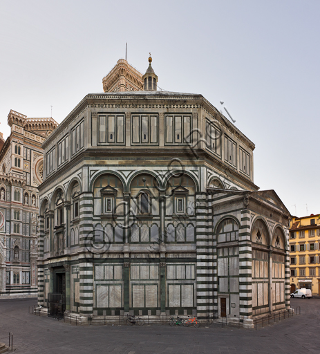 Florence, the Baptistery of St. John, exterior: the Northern-Western façade in Carrara white marble and green Prato marble with the door by Lorenzo Ghiberti on the Northern side.