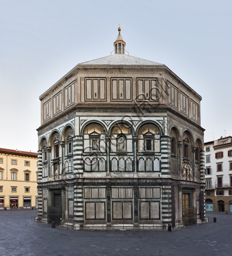 Florence, the Baptistery of St. John, exterior: the South  Eastern façade in Carrara white marble and green Prato marble with the door by Andrea Pisano on the South side and the Paradise door  by Lorenzo Ghiberti on the East side.