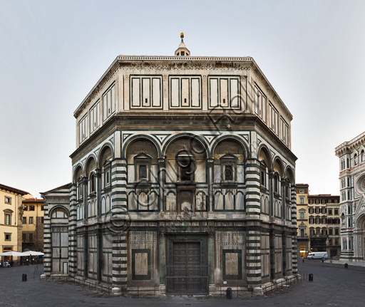 Florence, the Baptistery of St. John, exterior: the South  façade in Carrara white marble and green Prato marble with the door by Andrea Pisano.