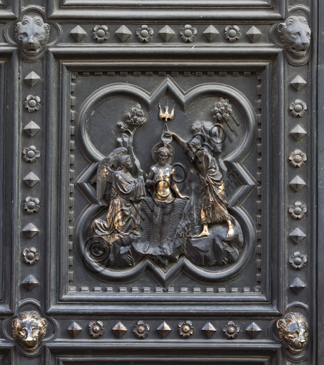 Florence, the Baptistery of St. John, exterior, the South  façade in Carrara white marble and green Prato marble: the door by Andrea Pisano (1330 -1336) with episodes of St. John's the Baptist life, the Cardinal Virtues and the Theological Virtues. Tile with the Baptism of Christ.