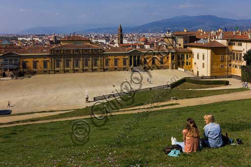   Florence, Boboli Gardens: tourists sitting on the grass in front of the Palazzina della Meridiana.