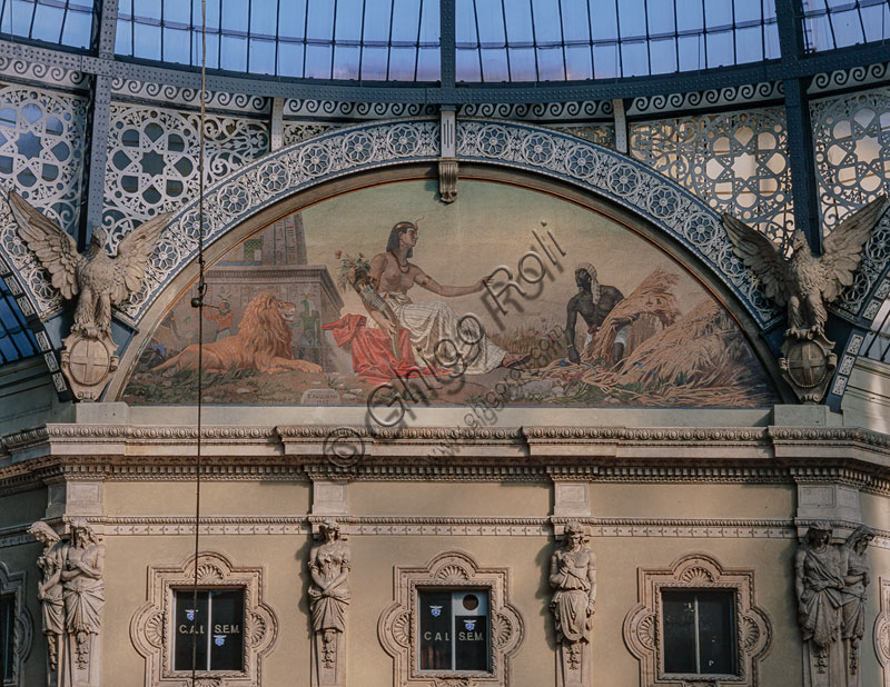  Vittorio Emanuele II Gallery, open in 1867: lunette at the top of one of the octagon walls. Decorated with an allegory painting of Africa who is represented in the clothes of an ancient Egyptian flanked by a lion and a Moor who gives her a bundle of wheat, by Eleuterio Pagliano.