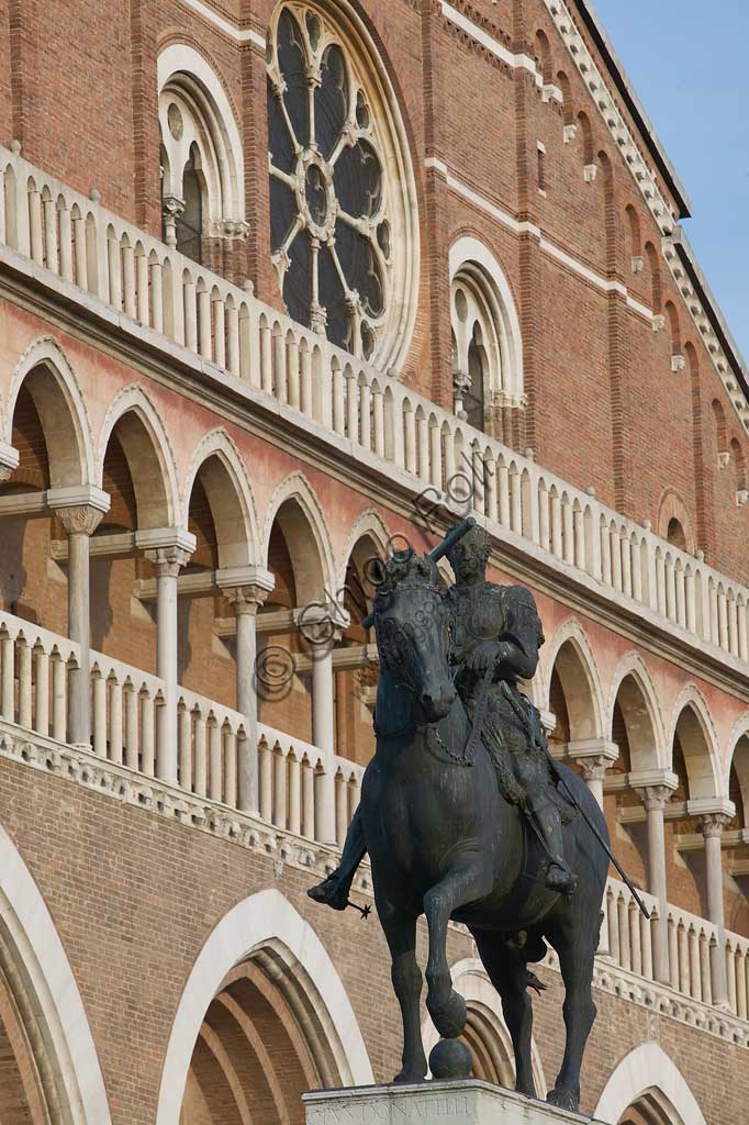   Padua, Piazza del Santo: partial view of the Basilica of St. Anthony or Basilica of the Saint. In the foreground, the equestrian statue representing Erasmo da Narni,  known as "Gattamelata", by Donatello (1453).