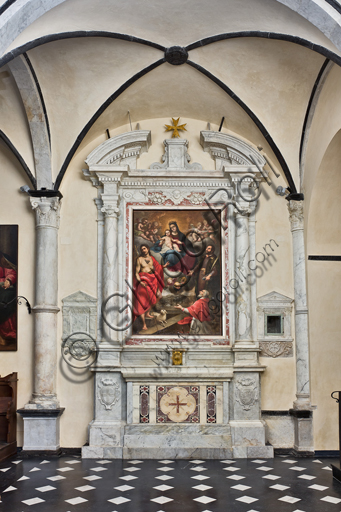 Genoa, Duomo (St. Lawrence Cathedral), inside, Baptistery (formerly Church of St. John the Old): lateral altar with "Madonna and Child, St. John the Baptist, Pierre d'Aubusson and St. Cosmas ", by Paolo Girolamo Piola, oil painting on canvas.