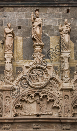 Genoa, Duomo (St. Lawrence Cathedral), inside, Chapel of St. John the Baptist: upper part of the front elevation, central small span (of five) starting from the right, with sculptures by Domenico, Giovanni ed Elia Gagini (1448-1450 ca.). On the top, statue of Faith, St. John the Baptist and Charity.