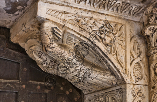 , Genoa, Duomo (St. Lawrence Cathedral), the north side, portal of St. John the Baptist (first half XII century): right corbel. Detail with “Angel”, symbol of St. Matthew, by Lombardy and Como sculptors.