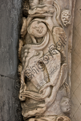 , Genoa, Duomo (St. Lawrence Cathedral), South side, the doorway of St. Gotthard (1155 - 1160), the lunette, internal fascia : “Monstrous figure”, by “First Master” and “First Helper” of the doorway of St. Gotthard.