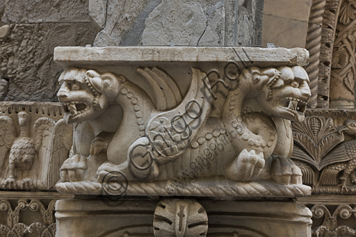 , Genoa, Duomo (St. Lawrence Cathedral), South side, the doorway of St. Gotthard (1155 - 1160), Prothyrum, left capital, dosseret: bicorporate dragons with serpentine tails, by Pisan - Lucchese workshop, “second master” and “second helper” of the doorway of St. Gotthard.